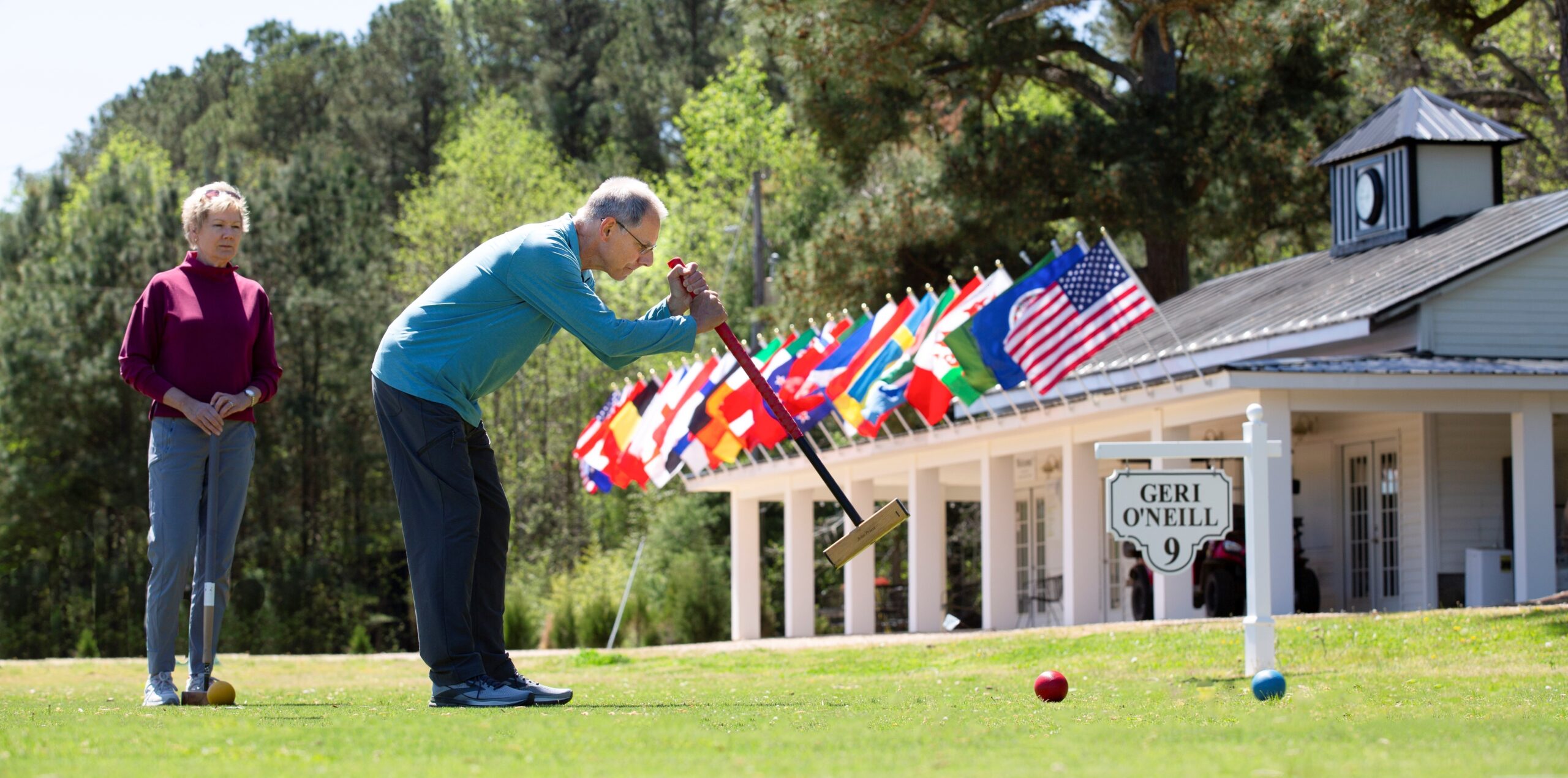 greg and pam with flags 4-13-24 jpeg